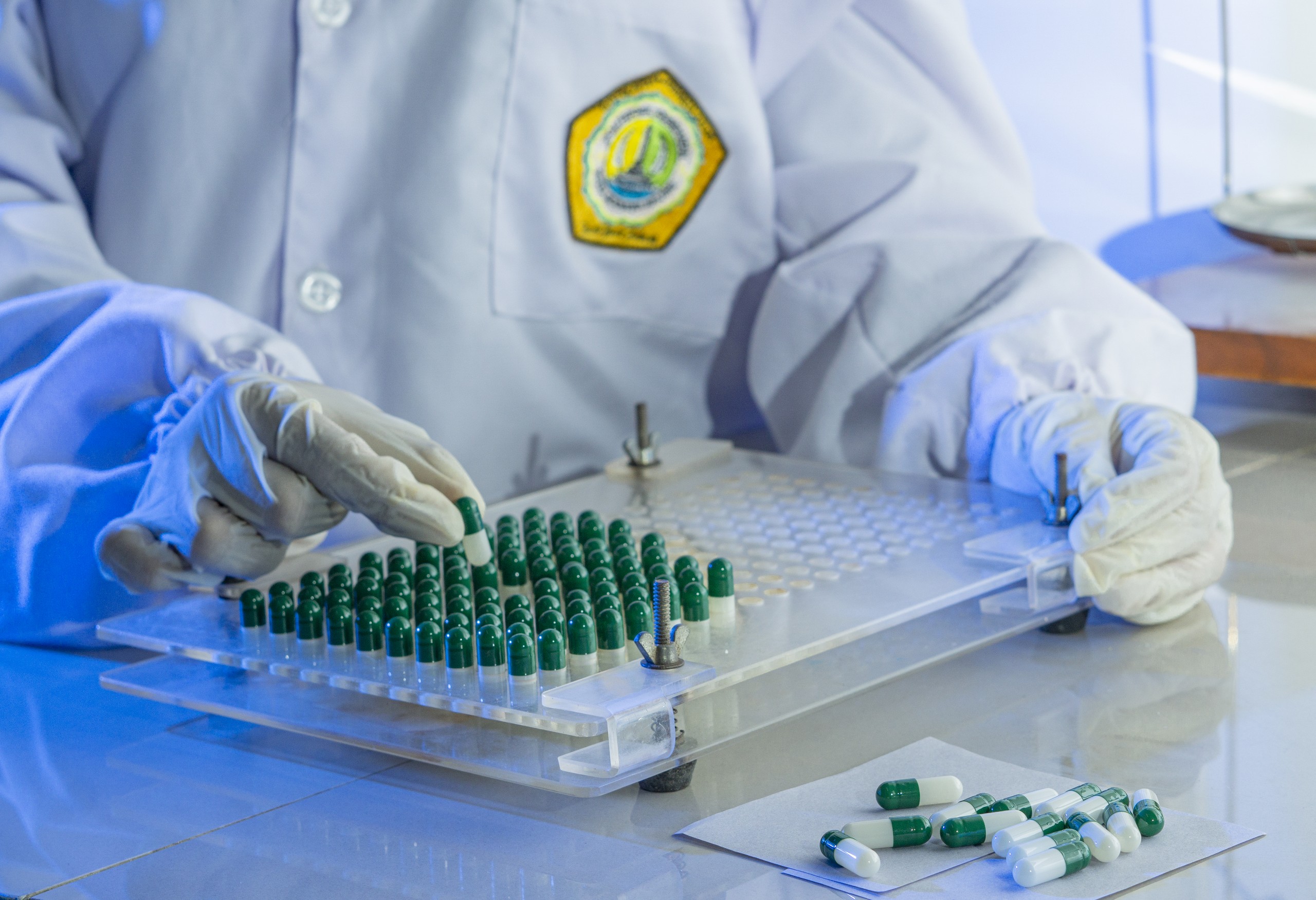 Automated rotary die encapsulation and pharmaceutical capsule manufacturing
